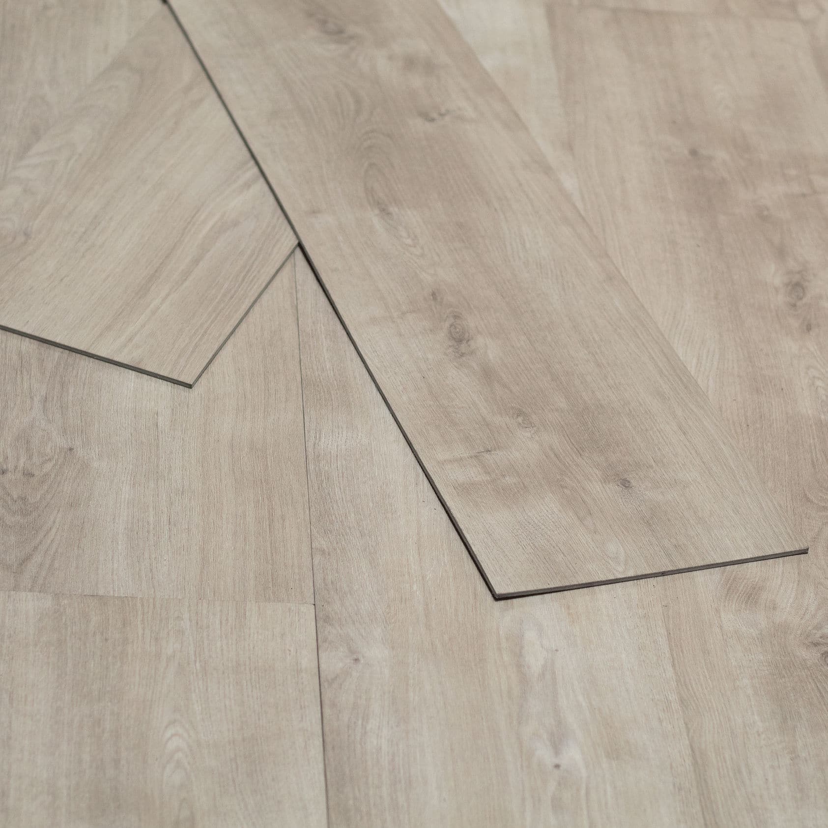 Mohegan Bluff Powell 4.5mm Luxury Vinyl Flooring — close-up of a loose plank showing the plank edge profile, Bering Floors & Coverings, SKU 11002-0101
