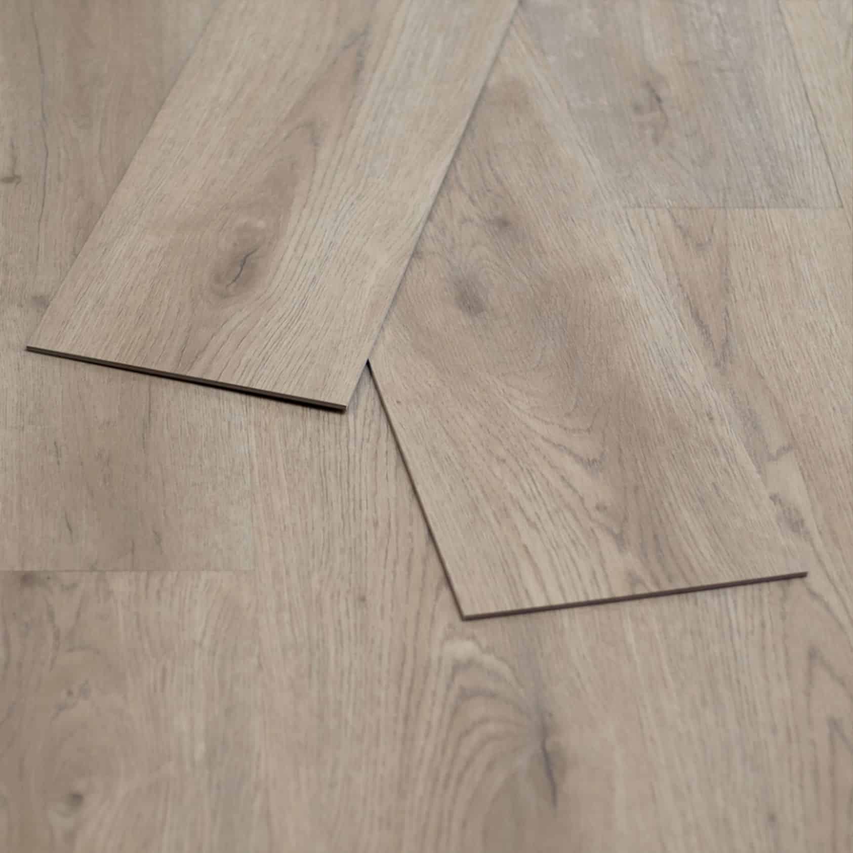 Arroyo Dune Powell Plus 2mm Fiberglass Gluedown Luxury Vinyl Flooring — close-up of two loose planks laid diagonally showing the plank edge profile, Bering Floors & Coverings, SKU 11006-0105