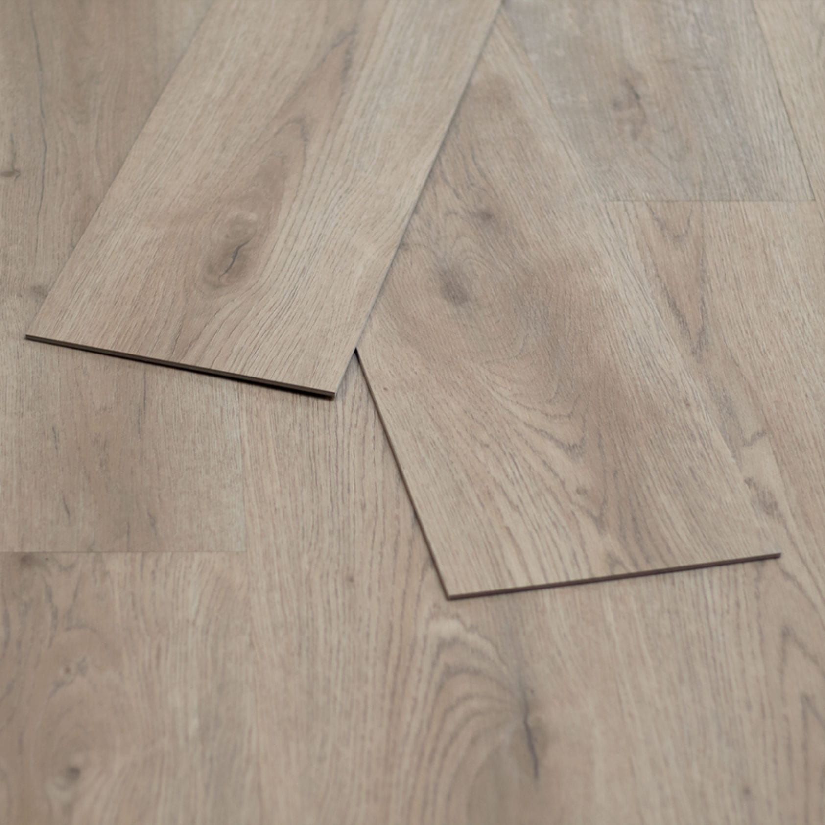 Arroyo Dune Powell 2mm Gluedown Luxury Vinyl Flooring — close-up of two loose planks laid diagonally showing the plank edge profile, Bering Floors & Coverings, SKU 11001-0105
