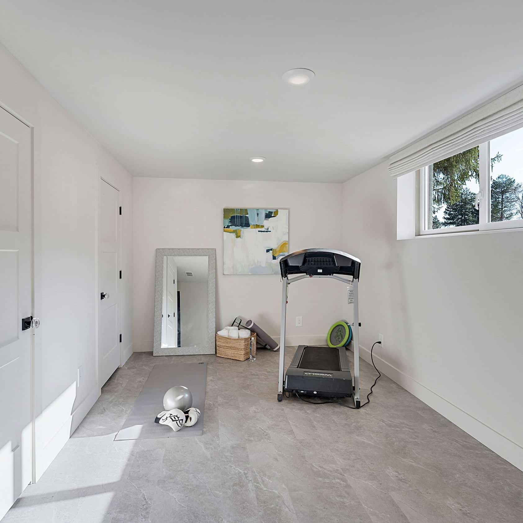 Pacific Palisades Tristao 4.5mm SPC Rigid Core Flooring installed in a home gym/flex room, Bering Floors & Coverings, SKU 12001-0301