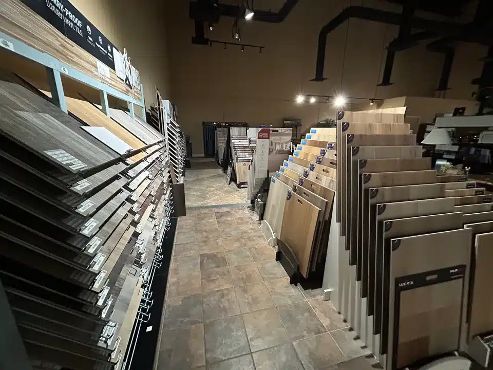 Vinyl flooring sample racks along an aisle in the Cloud Floor and Home showroom
