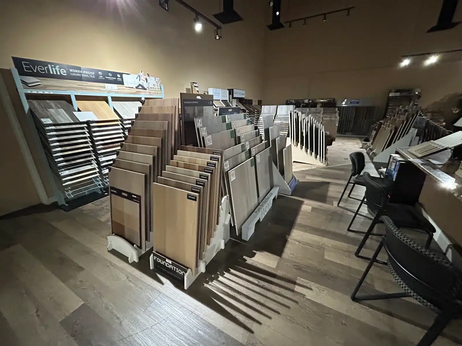 Vinyl plank flooring Las Vegas showroom displays with rows of light and dark samples