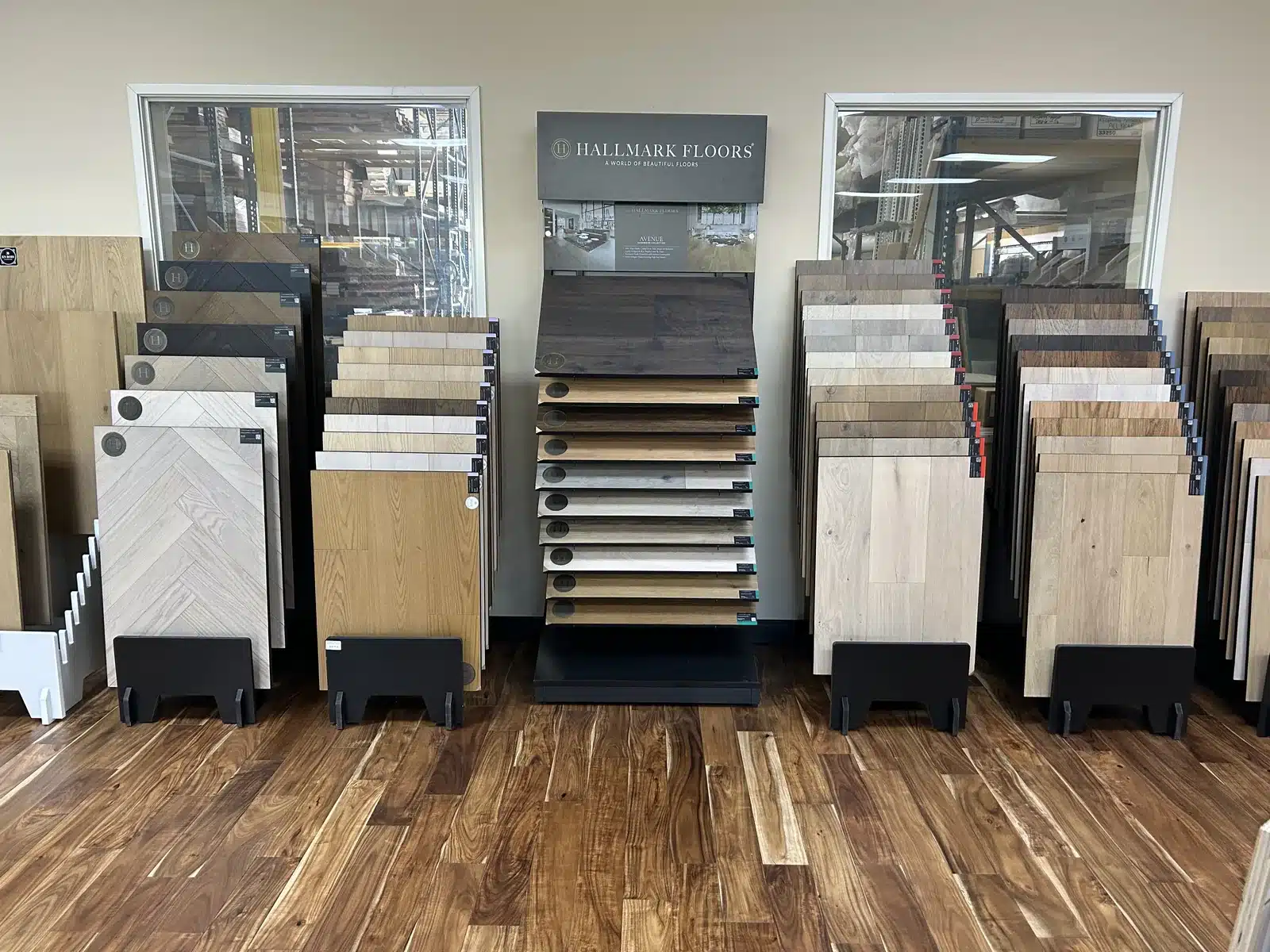 Wood flooring sample boards in light and dark finishes displayed at Cloud Floor and Home